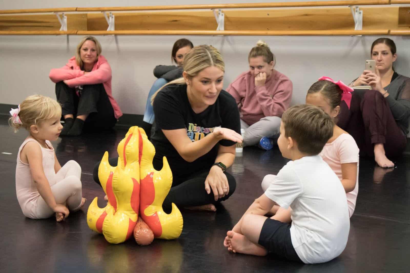 Dance teacher leading a preschool class
