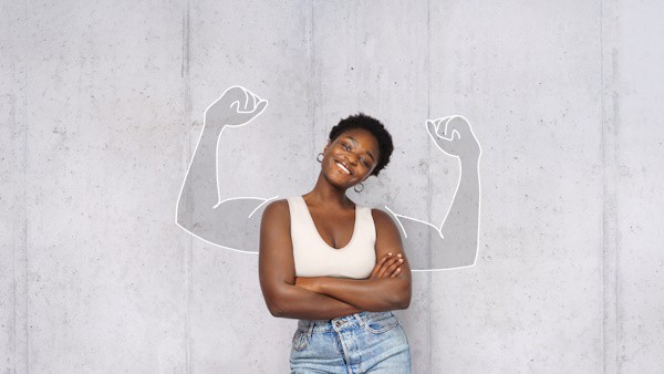 portrait of young happy afro woman looks in camera and shows muscles. success concept. portrait of young happy afro woman looks in camera and shows muscles. success concept.