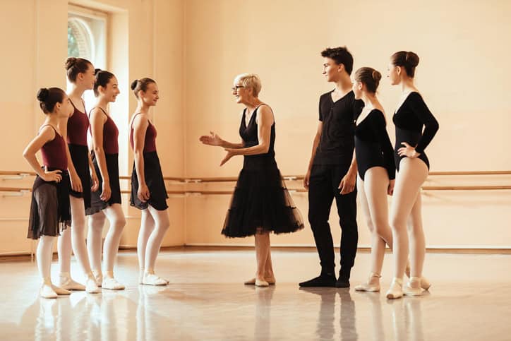 Dance teacher with ballet students